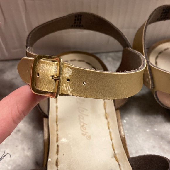 Used gold salt water sandles a little worn out but still cute and colorful. - Picture 5 of 8